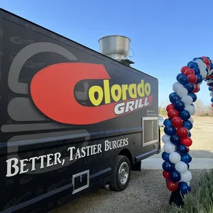 food truck decorated with balloons