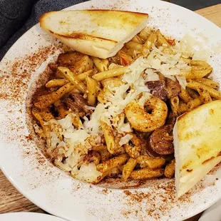 a plate of pasta with meat and cheese