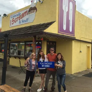 a group of people outside a store