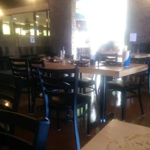 We are surrounded by Dirty unbussed tables.