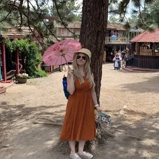 With cute medieval umbrella!