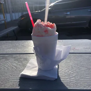 Medium vanilla ice cream stuffed bee York cheesecake with strawberry topped with sno cap !  Super yummy!!!!