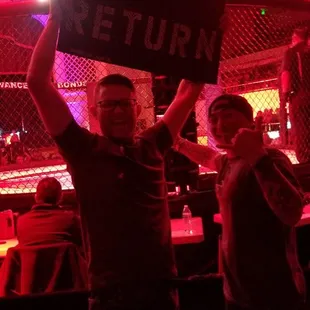 man holding a sign that says nat return