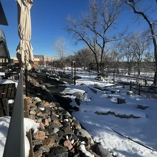 Patio is situated along a creek and running path