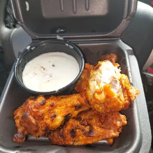 grilled wings with hot sauce and homemade bleu cheese.