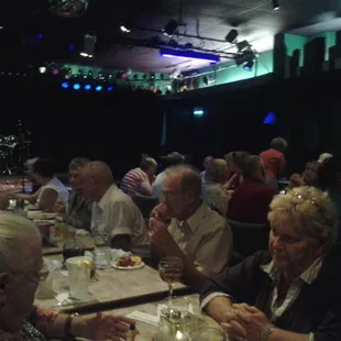 a large group of people sitting at a table
