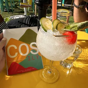 a cold drink with cucumber and lime