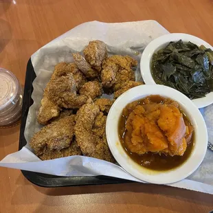 Fried catfish, fried shrimp, collard greens, yams, and tartar sauce