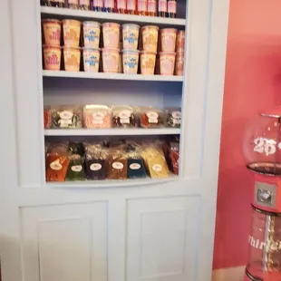 a shelf full of cupcakes