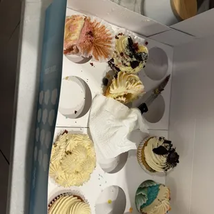 Half eaten Dozen Colossal Cupcakes