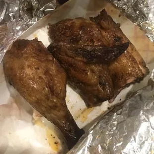 The tiniest leg and wing portion of the dried up half chicken