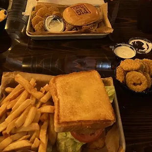 Fat Boy Sandwich and Barnyard Bourbon Pork with fried pickles, mac and cheese, and fries.
