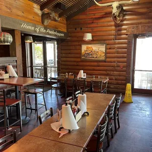 One part of the spacious interior dining area with a nice BBQ shack vibe and paper towel rolls as napkins.