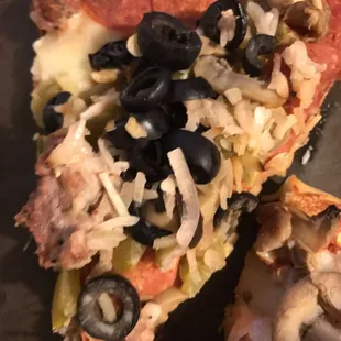 two slices of pizza with toppings