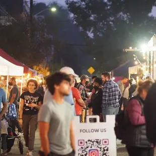 a crowd of people walking around