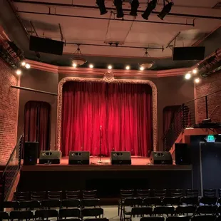 stage with red curtains and stage lights