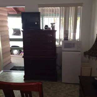 The fridge etc in the front room