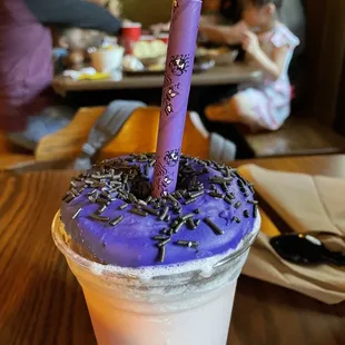 a purple frosted drink with sprinkles