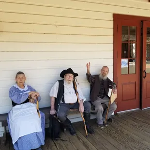 Local townspeople,  and 84 year old "Roger", waving on the right, takes requests on the piano. Leave a tip! He's worth every dollar!