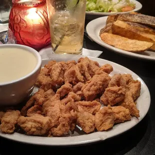 Lamb fries appetizer, steak fries in the back