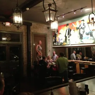 Some woman singing on a chair.
