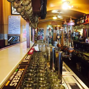 rows of glasses lined up on the bar