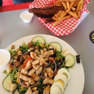 Lunch Special  Chicken Tenders tossed in buffalo sauce  Salad with grilled chicken.
