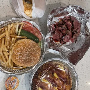 Cheese burger deluxe, pancake deluxe, Pastrami on rye and a bagel