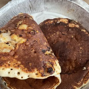 two pancakes in a foil container