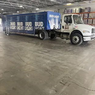 a bud bud bud light truck in a warehouse