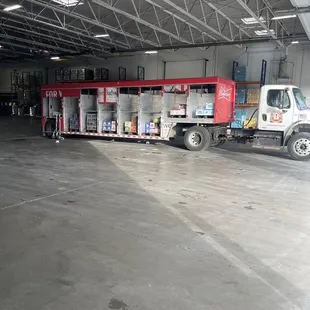 a truck and a truck in a warehouse