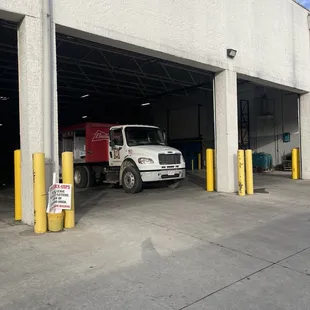 a delivery truck parked in a garage