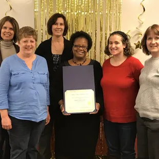 Graduation potluck and Lashawn Farmer my classmate receiving her coding certificate. I'm standing next to some of my instructors.