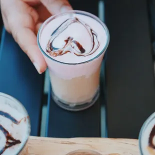 a person holding a cup of coffee