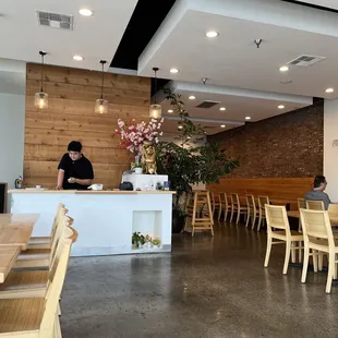 people sitting at tables in a restaurant