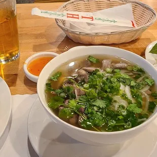 a bowl of soup and a plate of bread
