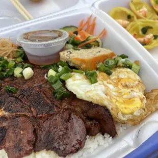 Com Tam Ba Thi ($13) is Com Tam Bi Cha Trung Suong / Broken rice with julienne pork, pork/egg loaf, grilled pork chop, and fried egg