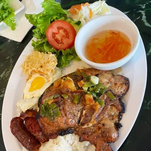 $9.50 Com Tam (Broken Rice) Plate with Pork Chop, Chinese Sausage, Tau Hu Ky, and Fried Egg