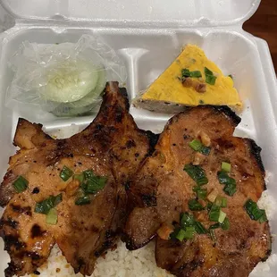 Togo Vietnamese pork chop with sides , quiche, fresh cucumbers and soup