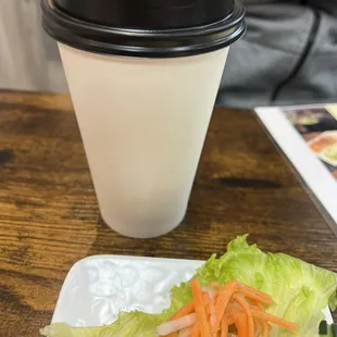 a plate of lettuce and carrots