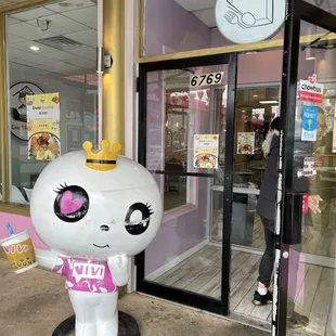 a woman walking in front of a store