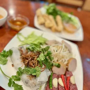 Bánh Cuon, steamed rice roll, stuffed with grounded pork &amp; mushroom, fried shallot, fresh herbs, bean sprout, ham topping, and more