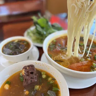 a bowl of soup with noodles