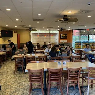 a large group of people sitting at tables