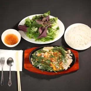 a plate of food and a bowl of rice