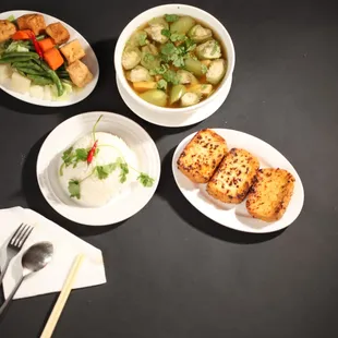 four bowls of food on a table