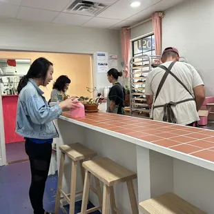 a group of people in a kitchen