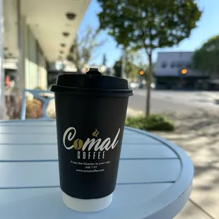 Outside sitting area enjoying my coffee with some sabor