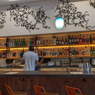 a man standing at a bar