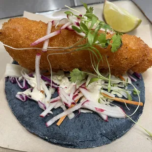 Gluten Free Fried Cod on a Blue Corn Tortilla.